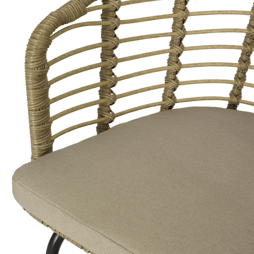 Noble House Randy modern wicker arm chair with water-resistant beige cushions, brown wicker frame, stylish outdoor seating.