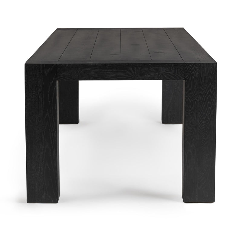 Classic Home Bristol dining table with wooden surface and sturdy legs, ideal for modern or traditional dining rooms.