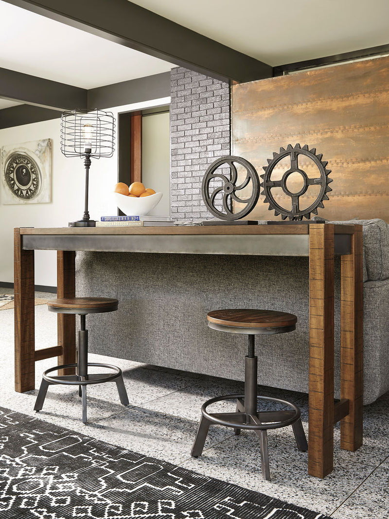 Torjin - 3 Pc. - Long Counter Table, 2 Stools - Dark Brown - R&R Furniture Gallery (Fountain Valley, CA)