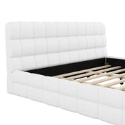 Dreamland upholstered platform bed with padded headboard, showcasing a modern design and soft fabric upholstery.