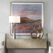 Framed print titled "Dawn On The Hills" by Uttermost, featuring a purple mountain landscape artwork with a sleek frame.