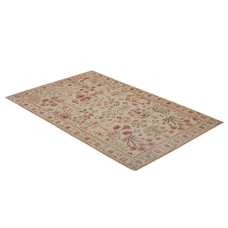 TOV Furniture Jardin 5x8 hand-woven wool area rug in brown with intricate patterns and soft texture.