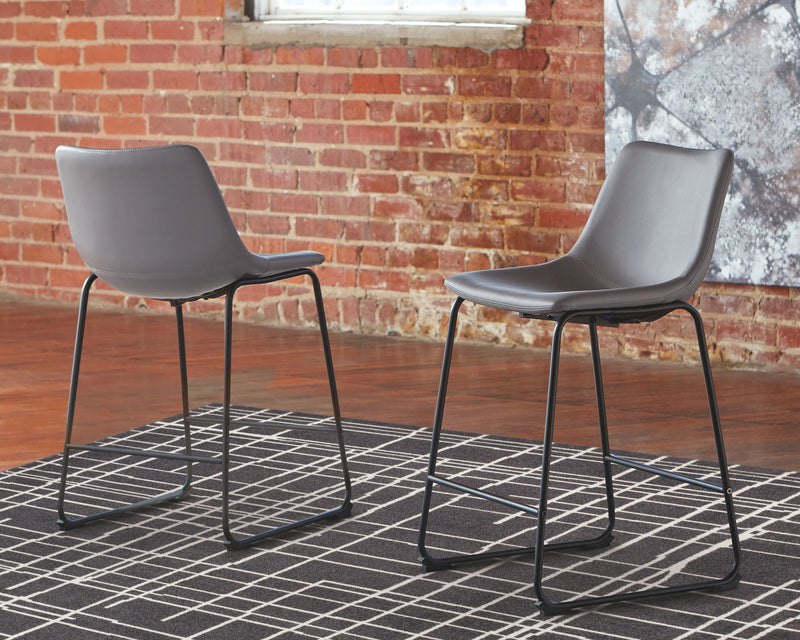 Set of two Signature Design by Ashley Centiar upholstered barstools with padded seats and backrests, perfect for kitchen or bar area.