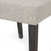 Contemporary Noble House dining chair with upholstered seat and tapered wooden legs, part of a stylish chair set.