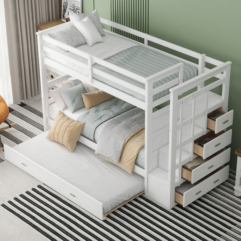 White DreamHaus twin over twin bunk bed with staircase and trundle, featuring safety rails and sturdy wood construction.