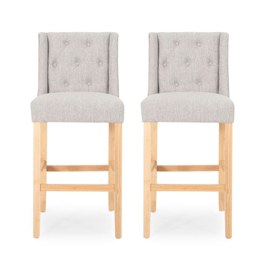 Set of two Noble House Vienna contemporary fabric tufted wingback counter stools with dark wooden legs.