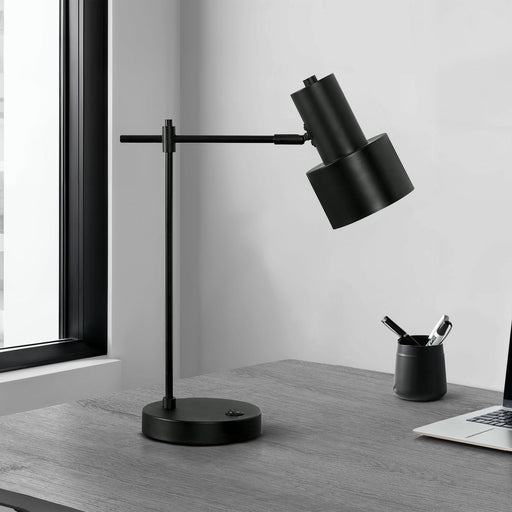 Modern black 8th Street table lamp with USB port, featuring a sleek design and illuminated shade, perfect for bedside or desk use.