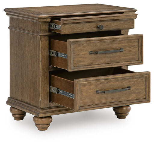 Medium brown Karallin three-drawer nightstand by Signature Design Ashley, featuring a sleek accent piece for bedroom storage.