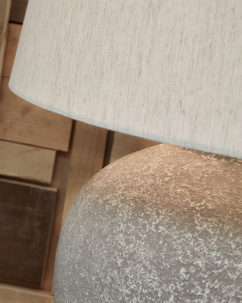 Dreward - Paper Table Lamp - Distressed Gray - R&R Furniture Gallery (Fountain Valley, CA)