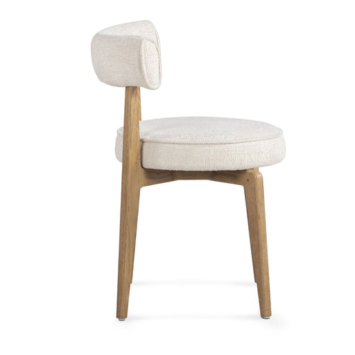 Cream fabric side dining chair by TOV Furniture with sleek design and plush upholstery, ideal for modern dining spaces.