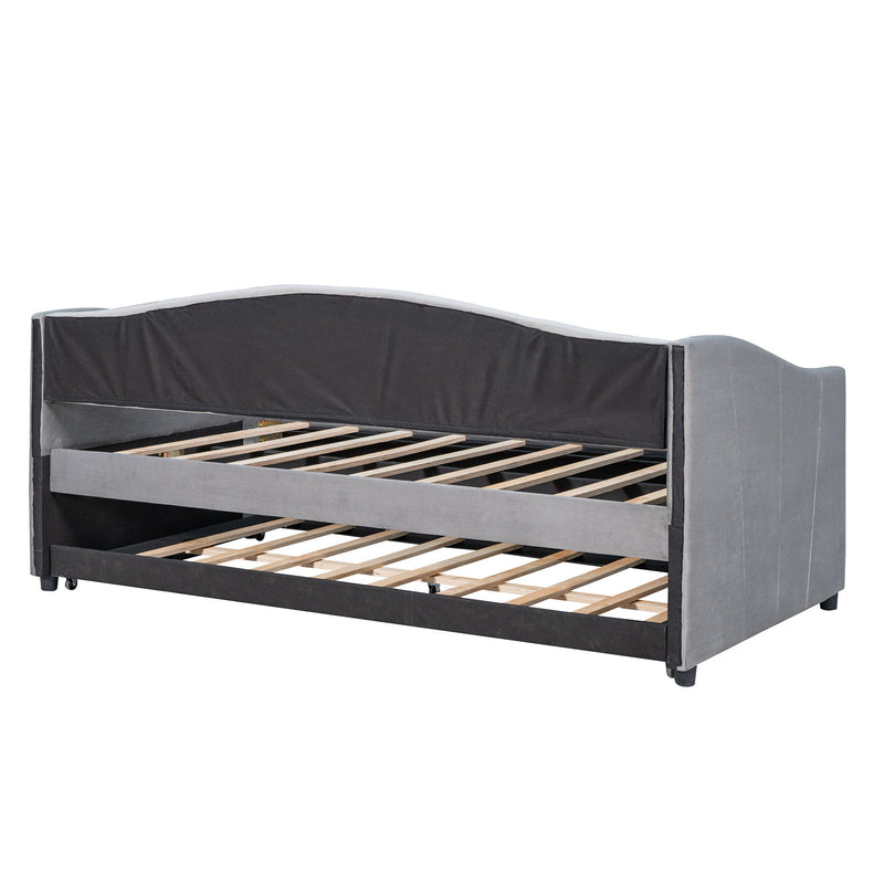 DreamHaus upholstered daybed sofa bed with built-in trundle bed and wood slat base, featuring plush fabric and sturdy wooden frame.