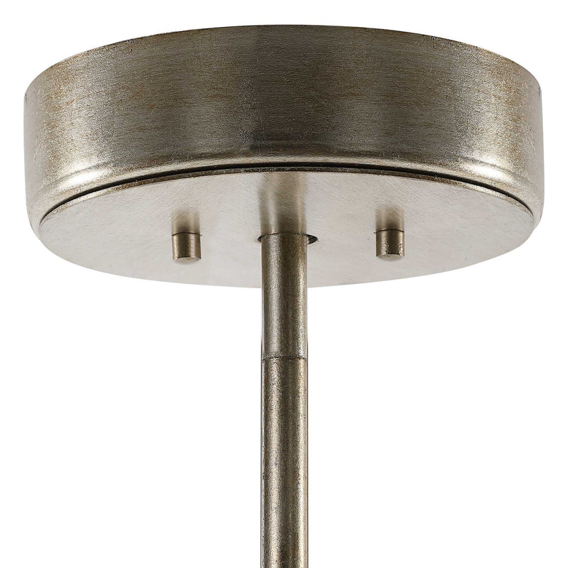 Uttermost Goccia tear drop glass pendant light hanging with a sleek, modern design and clear glass teardrop shape.