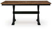 Signature Design by Ashley Wildenauer dining room extension table with a sleek counter table design, showcased in a modern setting.