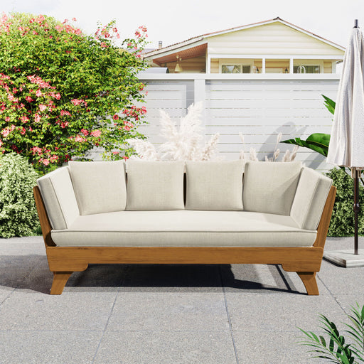 Noble House outdoor patio daybed sofa with three seats, foldable arms, and four back pillows on a garden patio.