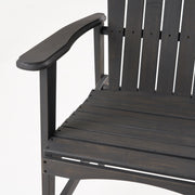Pair of Noble House outdoor weather-resistant acacia wood Adirondack dining chairs set on a patio.