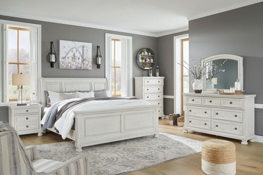 Robbinsdale Signature Design by Ashley sleigh bed set with six-piece bedroom furniture, featuring wood frame and elegant design.