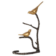 Black and gold "Birds On A Limb" sculpture by Uttermost, featuring detailed birds perched on a textured limb.