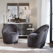 Uttermost Crue Fabric Swivel Chair with plush upholstery and modern design, shown from a side view.