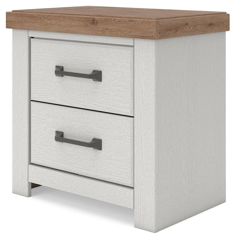 Benchcraft Savonport two-drawer night stand with charging station in white and brown wood finish, featuring sleek modern design.