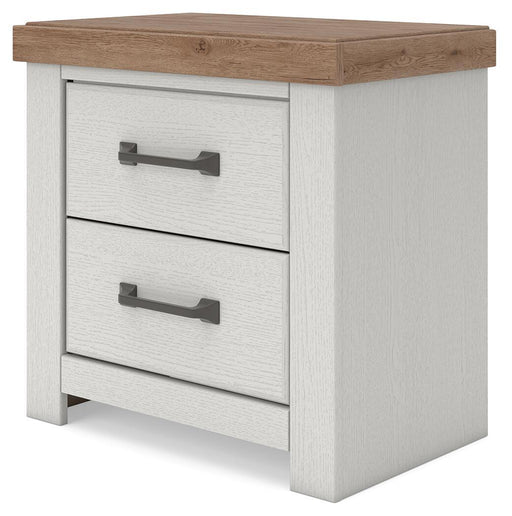 Benchcraft Savonport two-drawer night stand with charging station in white and brown wood finish, featuring sleek modern design.