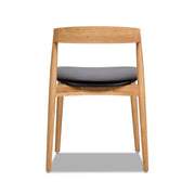 Raven - Stacking Sculpted Oak Dining Chair - Warm Natural Brown / Black - R&R Furniture Gallery (Fountain Valley, CA)