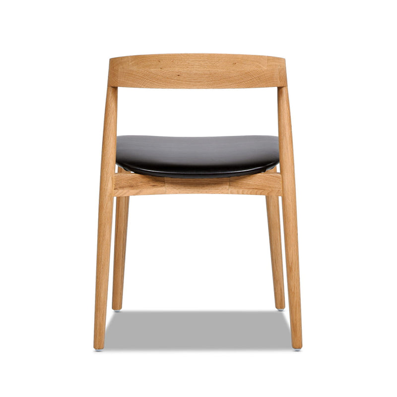 Raven - Stacking Sculpted Oak Dining Chair - Warm Natural Brown / Black - R&R Furniture Gallery (Fountain Valley, CA)