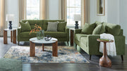 Signature Design by Ashley Bixler living room set with plush stationary sofas and loveseats in a modern living space.
