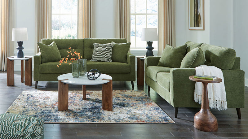 Signature Design by Ashley Bixler living room set with plush stationary sofas and loveseats in a modern living space.