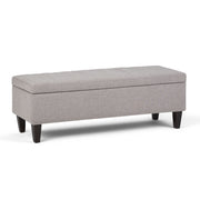 Simpli-Home Monroe upholstered storage ottoman with a soft fabric top and wooden legs, functional and stylish for living room.