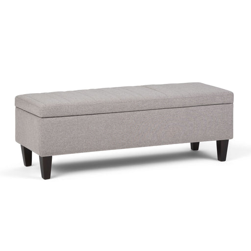 Simpli-Home Monroe upholstered storage ottoman with a soft fabric top and wooden legs, functional and stylish for living room.