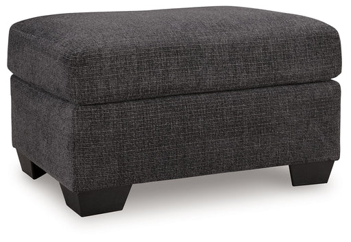 Benchcraft® upholstered ottoman with plush fabric and wooden legs, perfect as a versatile living room accent piece.