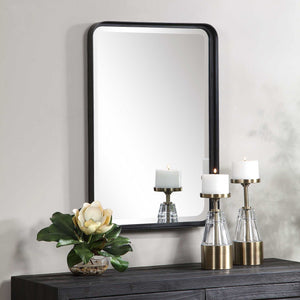 Uttermost Croften black vanity mirror with a sleek rectangular frame, designed for elegant bathroom or bedroom decor.