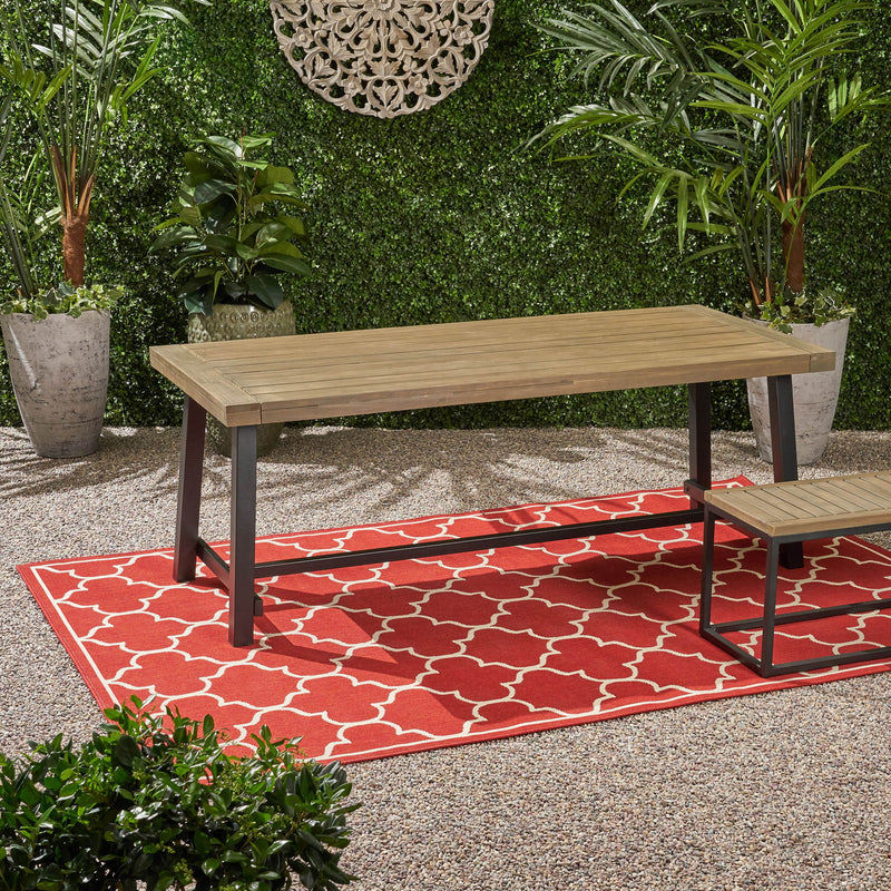 Rustic gray metal outdoor dining table by Noble House, showcasing a sturdy surface and modern design for outdoor dining spaces.