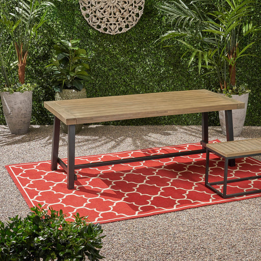 Rustic gray metal outdoor dining table by Noble House, showcasing a sturdy surface and modern design for outdoor dining spaces.
