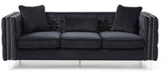 Glory Furniture Paige stationary sofa with plush cushions and fabric upholstery, shown in a modern living room setting.