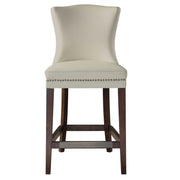 White Dariela counter stool by Uttermost with a sleek modern design and wooden legs, suitable for counter height seating.