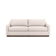Classic Home Aspen stationary sofa with plush cushions and neutral fabric, showcasing a modern living room setup.