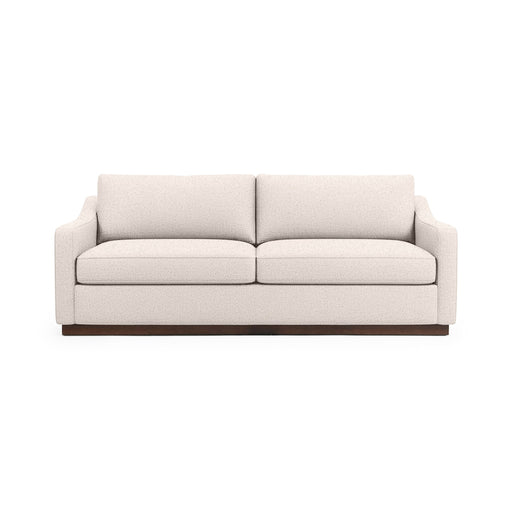 Classic Home Aspen stationary sofa with plush cushions and neutral fabric, showcasing a modern living room setup.