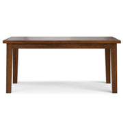 Simpli-Home handcrafted Eastwood dining table with a wooden surface and sturdy legs, ideal for family meals and gatherings.