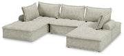 Signature Design by Ashley stationary sectional sofa with plush cushions and modern design, shown in a contemporary living room setting.