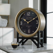 Black Shyam tabletop clock by Uttermost, featuring a sleek, modern design for stylish home or office decor.