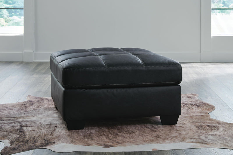 Benchcraft® Barlin Mills oversized accent ottoman with plush fabric and modern design, perfect for living room or lounge decor.