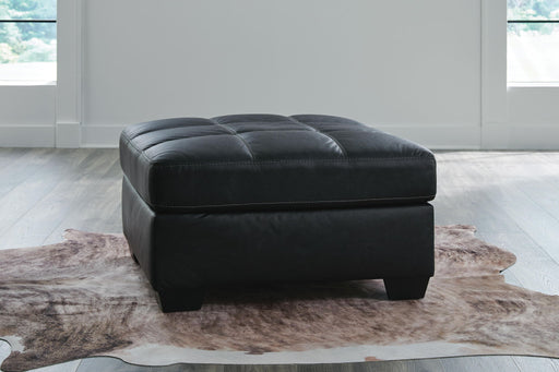 Benchcraft® Barlin Mills oversized accent ottoman with plush fabric and modern design, perfect for living room or lounge decor.