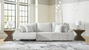 Signature Design by Ashley reclining sectional sofa with plush cushions and a modern design, shown in a living room setting.
