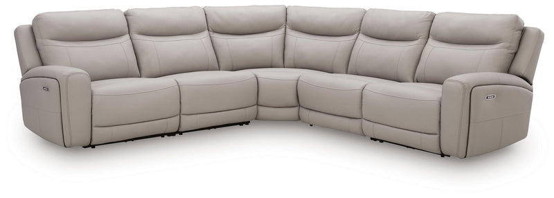 Benchcraft® Gravier reclining sectional sofa with plush cushions and reclining features in a modern living room setting.