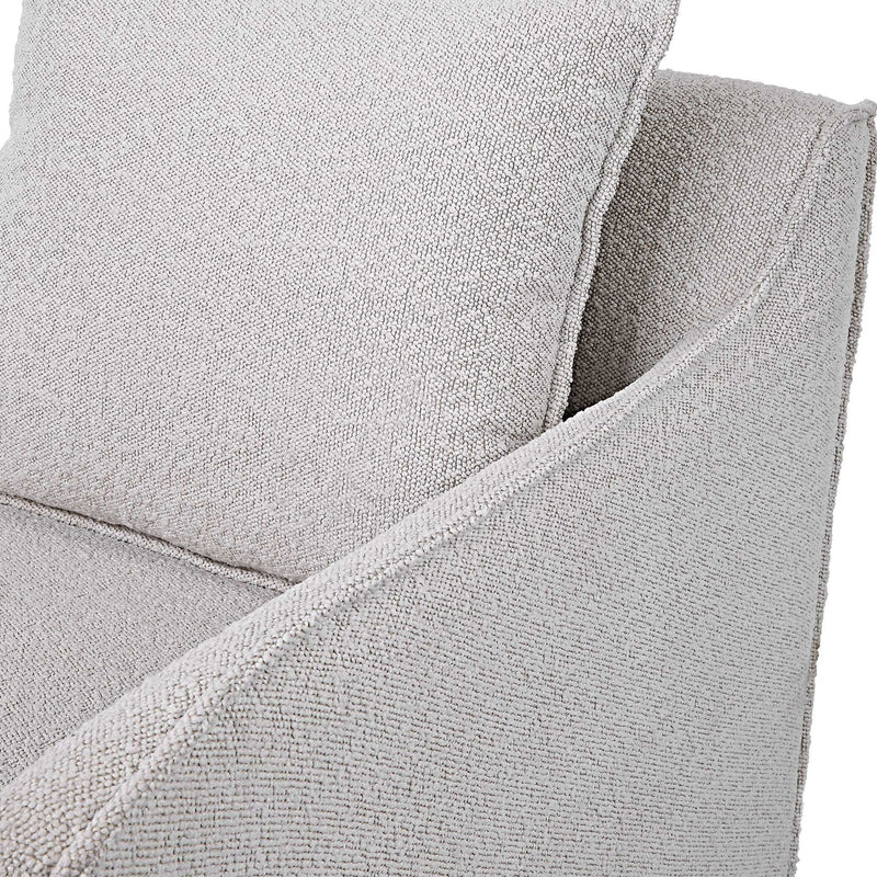 Gray Welland swivel chair by Uttermost with a modern design, featuring a cushioned seat and a swivel base.