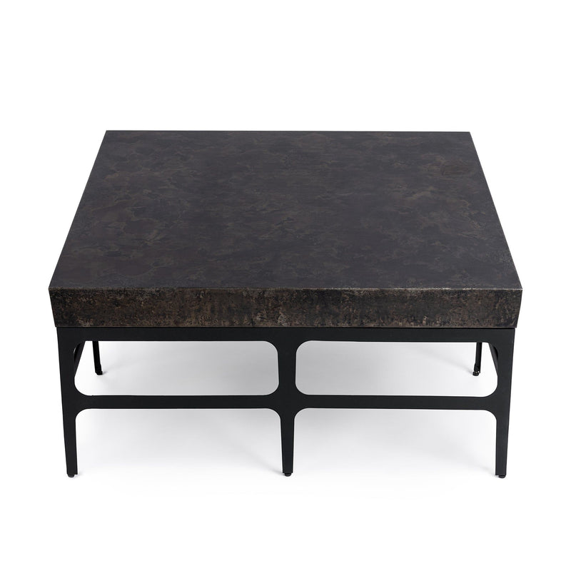 Rust noir Adela coffee table by Classic Home featuring a sleek, modern design with a sturdy metal frame and round wooden top.