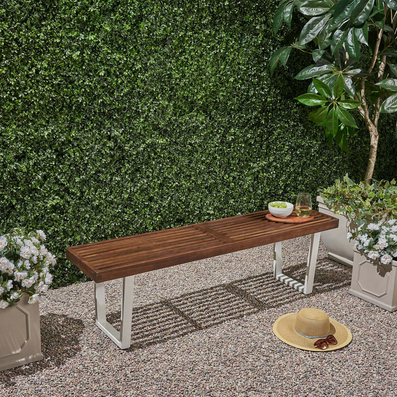 Noble House Intrinsic outdoor dining bench with slat top, sturdy wooden design perfect for patio or garden seating.
