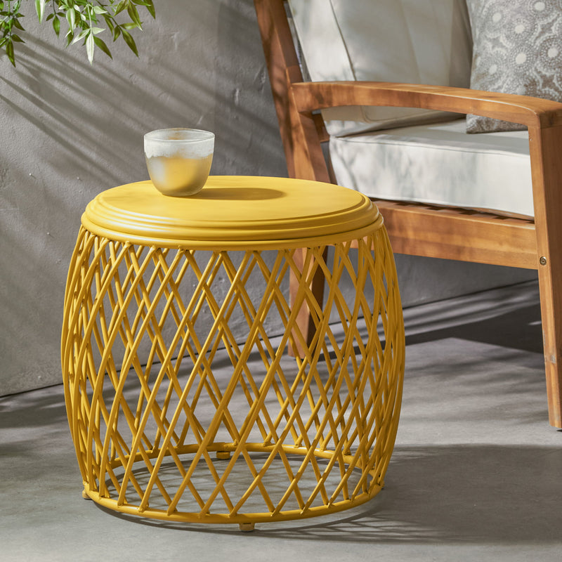 Noble House Alamera side table with wooden top and metal frame, modern design, placed beside a sofa in a stylish living room.