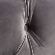 Noble House modern glam upholstered ottoman with plush fabric and sleek design, suitable as footrest or accent piece.